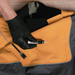 Gear Aid Aquaseal FD being applied to a drysuit