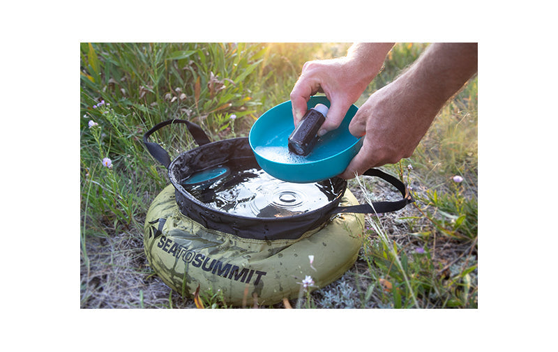 Camp Kitchen Clean Up Kit in use washing dishes at camp